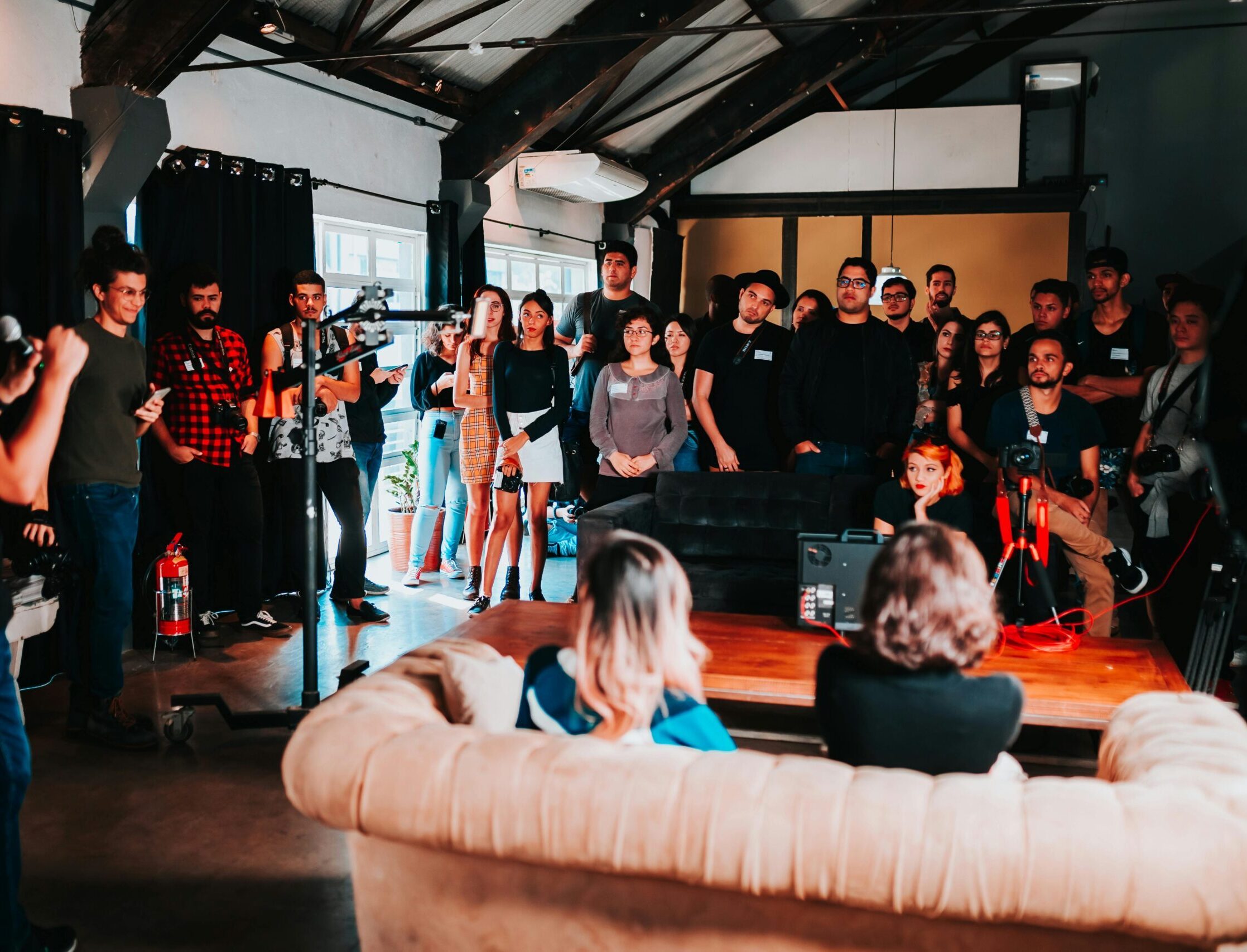 Vibrant business seminar in São Paulo with a diverse audience engaged in a speaker's presentation.